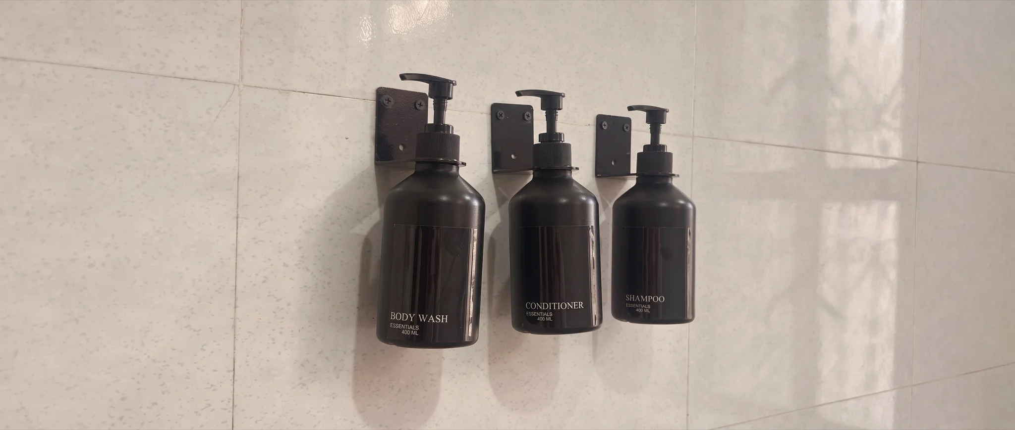 Body wash, conditioner, and shampoo dispensers in the bathroom